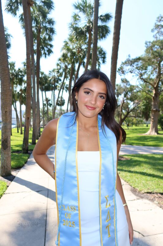 Woman with graduation stoles on