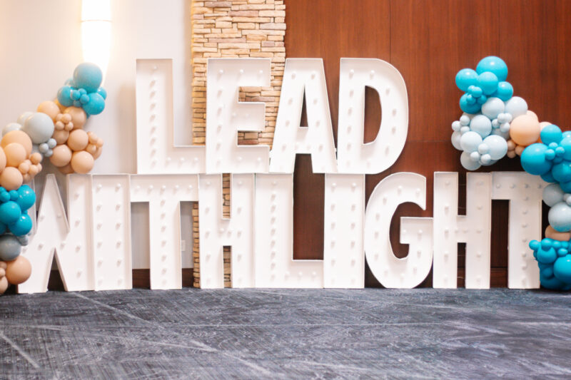 Marquee letters that spell out Lead with Light